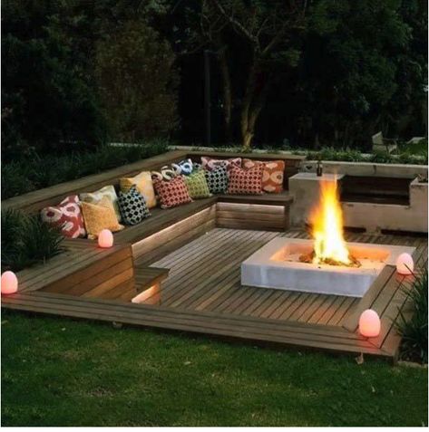 built-in deck seating with fire pit Outdoor Fire Pit Seating, Sunken Fire Pits, Backyard Ideas For Small Yards, Backyard Seating Area, Outdoor Fire Pit Designs, Fire Pit Landscaping, Sloped Backyard, Wooden Deck, Backyard Seating