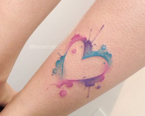 Watercolor Tattoos: Splatter Heart. A heart tattoo that uses watercolor style to create a blue, pink, and purple splattering effect. Click through for 20 watercolor tattoo ideas. #watercolortattoos #tattooideas #tattoos IG: @arianetattooist Purple Heart Tattoos, A Heart Tattoo, Watercolor Heart Tattoos, Traditional Heart Tattoos, Small Watercolor Tattoo, Mother Tattoos For Children, Watercolor Tattoo Ideas, Purple Tattoos, Pink Tattoo