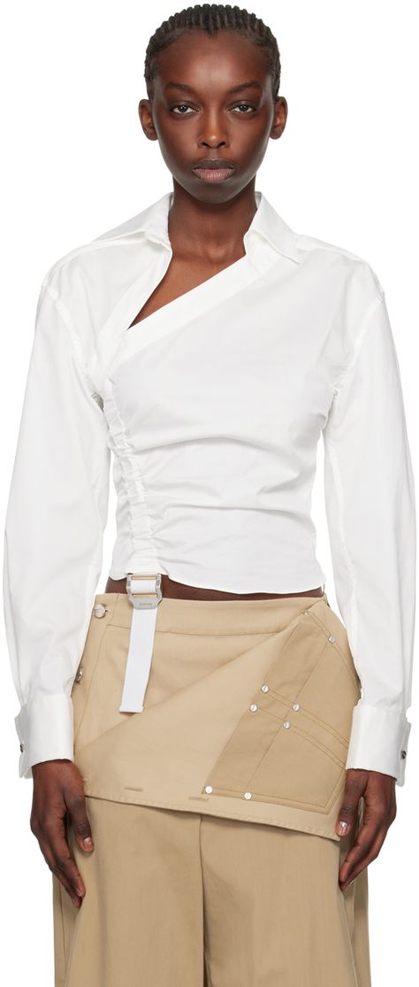 Stretch cotton-blend poplin shirt. Ruching throughout. · Offset pointed collar · Adjustable cinch strap at front · Concealed zip closure at side seam · Pleats at cuffs · Detachable logo-engraved graphic cufflinks Supplier color: Ivory White Collar Top Outfit, Asymmetrical Button Down Shirt, Reconstructed Shirt, Detachable Clothing, White Shirt Fashion, Fashion Study, Exaggerated Sleeve, Ruched Shirt, Knot Shirt