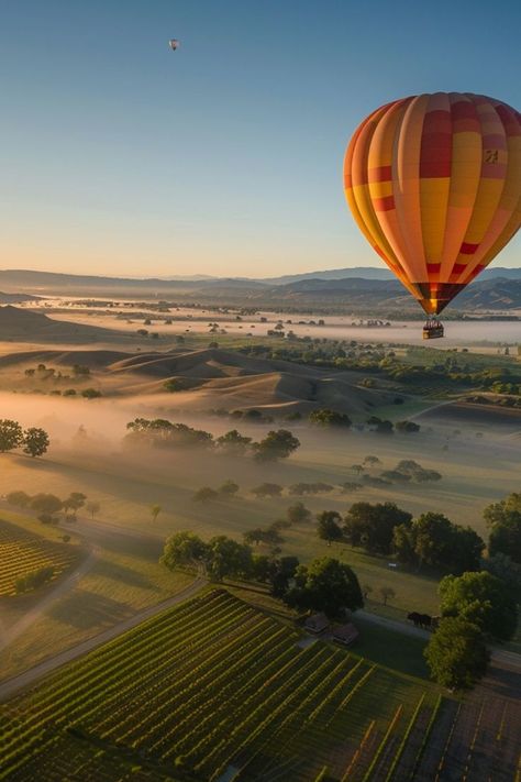 Float Above Stunning Landscapes with Hot Air Balloon Rides 🎈✨ Take to the skies with a hot air balloon ride. Enjoy panoramic views of beautiful landscapes, from rolling hills to serene valleys, and experience the tranquility of floating above it all. 🌿🌄 #HotAirBalloon #AdventureTravel #SkyHighAdventures Napa Hot Air Balloon, Napa Valley Hot Air Balloon, Hot Air Balloons Photography, Hot Air Baloons, Hot Balloon, Goal Setting Vision Board, Flying Balloon, Hot Air Balloon Ride, Bucket List Vacations