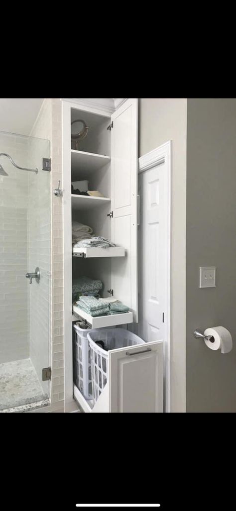 Hidden Laundry In Bathroom Small Spaces, Small Laundry Built In Cabinets, Bathroom Laundry Cabinet Storage Ideas, Storage Next To Bathtub, Pull Out Shelves Bathroom, Hidden Hamper In Bathroom, Cupboards In Bathroom, Bathroom Pull Out Storage, Hidden Laundry Hamper Bathroom