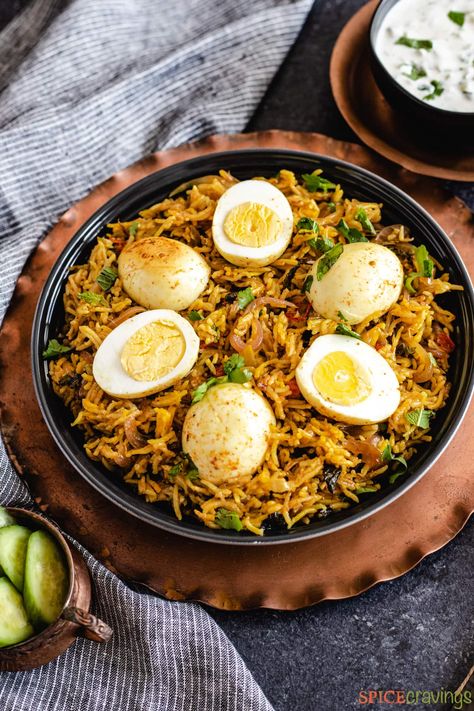 This Egg Biryani recipe in the Instant Pot stars delicately cooked eggs and rice with store-bought biryani mix for a one-pot vegetarian meal. #eggbiryani #instantpot #vegetarian Egg Biryani Recipe, Egg Biryani, How To Reheat Rice, Egg Roast, Boiled Egg Recipes, Fried Rice Recipe Easy, Spicy Eggs, Cucumber Raita, One Pot Vegetarian