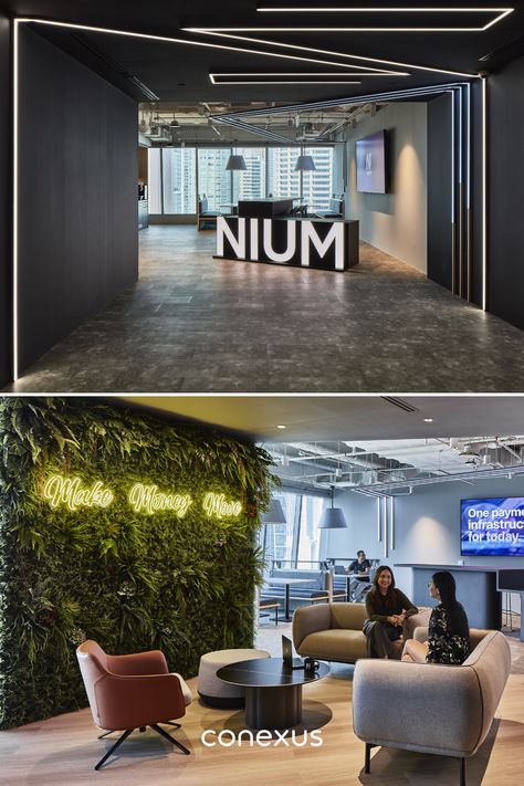 The departure from conventional office norms is further exemplified with a large Nium logo replacing a dedicated reception desk. The entrance is strategically dimmer with a lowered ceiling, crafting a sense of anticipation as visitors step into the office.  #modernreceptiondesign #luxuryofficedesign #fintechreception Office Reception Design Entrance, Open Office Design Workspaces Interiors, Office Entrance Design Entryway, Modern Office Reception Design, Reception Desk Design Entrance, Office Lobby Reception Waiting Area, Office Entrance Design, Headquarters Office Design, Office Reception Area Design