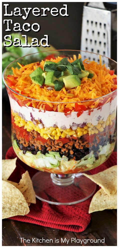 Layered Taco Salad {For a Crowd or Family Taco Night!} ~ Whip up this Layered Taco Salad instead of stuffing those taco shells! Perfect for lower-fuss taco night prep, or for making salad for a crowd. #tacosalad #layeredsalad #taconight #TacoTuesday www.thekitchenismyplayground.com Taco Salad For Party, Layer Taco Salad, Layered Salads For Parties, Mexican Layered Salad, Taco Salad For A Large Crowd, 7 Layer Taco Salad, Seven Layer Taco Salad, Layered Taco Salad Recipe, Seven Layer Taco Salad Recipe