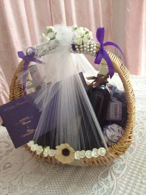 Inviting close relatives for your wedding: My wedding had a lavender theme. We had the Wedding Invitation card , a bottle of wine , scented candles( Lavender fragrance), potpourri( lavender), cakes and chocolates in that basket. Including the wine and cakes was a good choice because the wedding was on December..    :) Lavender Cakes, Wedding Card Basket, Candle Invitation, Candles Lavender, Lavender Theme, Luxury Gift Basket, Creative Gift Baskets, Card Basket, Hindu Wedding Invitations