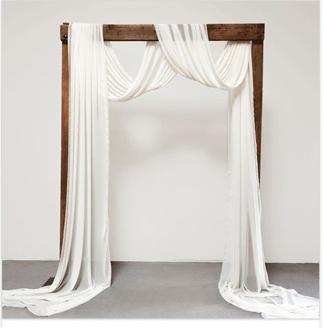 Minimal Wedding Arch Decor, Cloth Arch Wedding, Wedding Arbour With Fabric, Cheesecloth Draping Wedding, Fabric Arch Wedding, Wedding Arch Cloth Draping, Ceremony Arch Draping, Wooden Wedding Arch With Drape, Drapery Arch Wedding