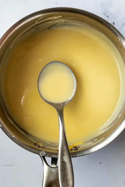 Discover the joy of making Creamy Lemon Butter Sauce with this simple recipe. It combines wine, cream, and lemon for a luscious and zesty sauce. Ideal for pairing with grilled chicken, fish, pasta, and vegetables. Try it now and transform your meals! Lemon Cream Sauce For Fish, Lemon Butter Sauce For Fish, Creamy Sauce For Fish, Creamy Lemon Butter Sauce, Pasta And Vegetables, Sauce For Fish, Lemon Cream Sauce, Creole Sauce, Fish Pasta