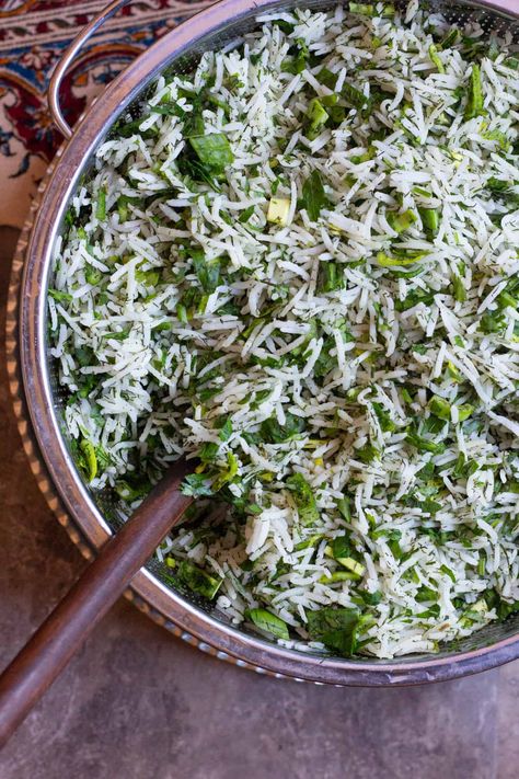 Sabzi Polo is a delicious Persian herb rice that's served with fish for Persian new year. Rice mixed with a selection of aromatic herbs makes this a great side dish to serve when you're feeding a crowd! #Persianfood #ricerecipes #easyricerecipes Jeweled Persian Rice Pilaf, Persian Herb Rice, Persian Rice Dishes, Aromatic Rice Recipe, Persian Dishes Iranian Food, Persian Recipes Iranian, Vegan Persian Recipes, Herb Rice Recipes, Persian Dill Rice Recipe