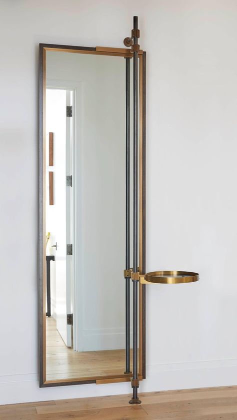 This full height mirror is housed in an oxidized oak frame with a warm brass decorative bezel. The round, swing arm tray, has an oxidized oak base with a solid brass surround and visible hardware. The Loft system's blackened steel support post runs Loft Mirror, Big Wall Art, Nate Berkus, Dressing Mirror, Brass Decor, Large Mirror, Bathroom Wall Decor, A Mirror, Mirror Designs