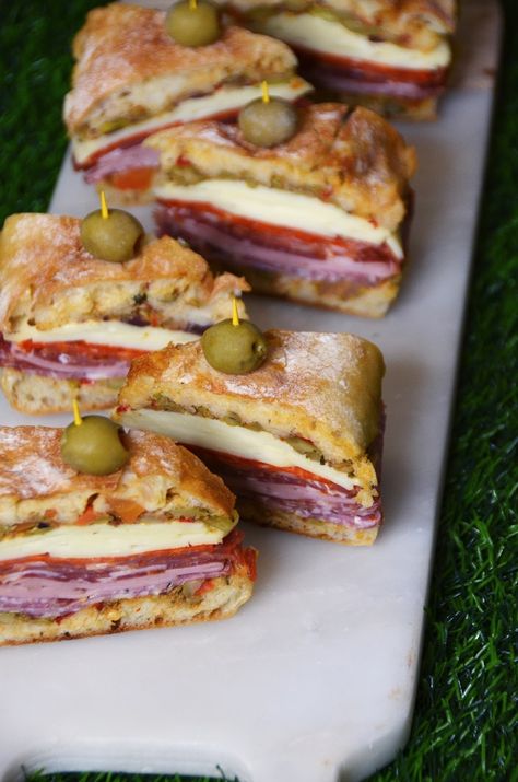 New Orleans Style Muffaletta Sandwich Bites - Always Order Dessert New Orleans Muffaletta Sandwich, New Orleans Foods, Muffelata Sandwich Recipe, Sandwich Buffet Ideas, Muffuletta Sliders, Sandwich Appetizers, Sandwich Bites, Sandwich Buffet, Muffaletta Sandwich