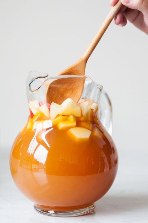 Caramel Apple Sangria Apple Sangria Recipes, Caramel Apple Sangria, Apple Sangria, Caramel Vodka, Apple Cider Caramels, Sangria Recipes, Fall Drinks, Caramel Apple, Ginger Ale