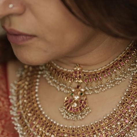 Gold & Antique Jewellery on Instagram: "Two masterpieces designed to make your special day truly unforgettable. Each element of the necklace is carefully designed to enhance your bridal glow, featuring beautiful rubies, diamonds, emeralds, pearls and shimmering gold that reflect timeless beauty. 

To own these gorgeous 22k Gold necklaces call or WhatsApp at +919986001216.

With over 50 years of combined design and jewelry expertise from Co-founders @ashwini.oza and @chetgr, each in-house creation at @arnav_jewellery, whether in SILVER or GOLD, guarantees you’re obtaining a true masterpiece.

#webelieveinhandmade #jewelleryrevivalist #jewellery #jewellerydesigner #goldjewellery  #handcraftedjewellery #arnavjewellery  #ashwinioza #sbao #22kgold #necklace #sustainablefashion #jewelleryofindia Arnav Jewellery, Gold Antique Jewellery, Amrapali Jewels, 22k Gold Necklace, Temple Jewelry Necklace, Gold Temple Jewellery, Neck Pieces Jewelry, Temple Jewelry, Antique Bridal Jewelry