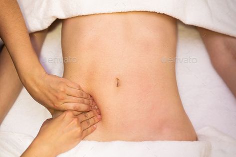 Woman receiving a belly massage in a physiotherapy center by javi_indy. Top view of hands massaging female abdomen in a physiotherapy center. Therapist applying pressure on belly #Sponsored #center, #physiotherapy, #Top, #javi_indy Tummy Massage, Belly Massage, Corporate Brochure Cover, Interesting Science Facts, Hand Massage, Science Facts, Chiropractic, Top View, Anime Character