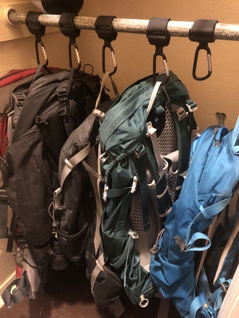 Use stroller keepers with heavy Velcro and carabiner clips to make backpack storage neat and tidy in a closet. No need for hooks that are stationary, or hangers that will break. Backpack Storage Bedroom, Hiking Gear Closet, Camping Closet Organization, Backpacking Storage Ideas, Hiking Gear Organization Ideas, Closet Gear Storage, Rucksack Storage Ideas, Hiking Closet Organization, Backpacks Storage Ideas