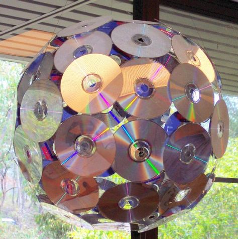 I've used CDs for something like this before. Now...to collect a bunch all over again... Rock And Roll Aesthetic Birthday, School Of Rock Theme Party, Rock N Roll Float Ideas, Concert Party Ideas, Disco Party Balloon Garland, 80s Centerpieces Diy Table Decorations, Display Photos At Party, Glam Rock Party Decorations, Rock And Roll Theme Party Decorations