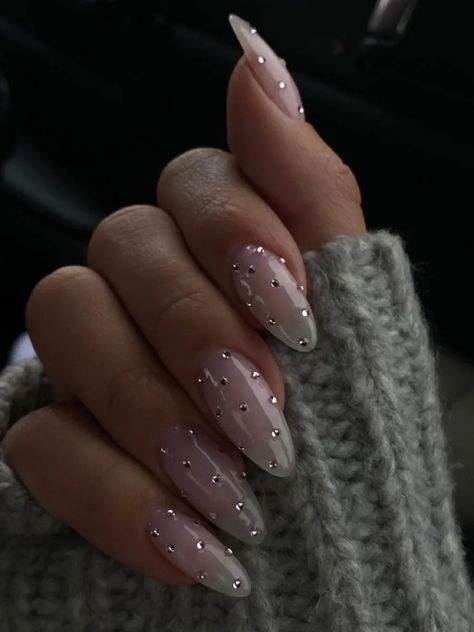 New Years Nails Sparkly Silver, Grey New Years Nails, Holiday Nails With Gems, Black And White Coquette Nails, Nails Inspiration With Charms, Winter Nail Inspo Almond, Pearl Christmas Nails, Nail Inspo Diamonds, Neutral Nails With Rhinestones