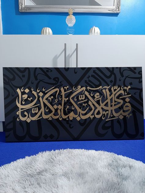 "Order from my instagram directly via DM and avail 10% discount with code \"Happiness\" .. link down below https://instagram.com/fma_artistry?igshid=MmVlMjlkMTBhMg%3D%3D&utm_source=qr Original Handmade Islamic Calligraphy Painting on stretched canvas with acrylic paints and gold leaves.. Backgroud is Kiswa Kabah Painting. And on top a Quranic Verse of Surah Al Rehman فَبِأَىِّ ءَالَآءِ رَبِّكُمَا تُكَذِّبَانِ which means \"So, which of the favours of your Lord will you belie?\" is written with gold leaves to give rich gold look. Size of the canvas is 20x38 inches and depth of canvas is 3.8 cm. High gloss varnished. Dust proof. Sun damage proof." Kabah Painting, Islamic Calligraphy Quran, Canvas Art Painting Abstract, Arabic Calligraphy Painting, Islamic Art Canvas, Art Painting Tools, Islamic Caligraphy Art, Islamic Calligraphy Painting, Calligraphy Art Print