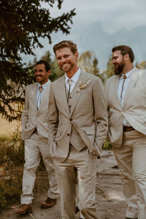 Classy, modern, and handsome groom attire for this adventurous Grand Teton Wyoming elopement. The bolo tie gives a western spin to this tan colored suit. Modern Groom Attire, Tan Groomsmen Suits, Tan Groomsmen, Tan Suit Wedding, Wyoming Elopement, Rustic Wedding Suit, Wedding Groomsmen Attire, Groom And Groomsmen Suits, Modern Groom