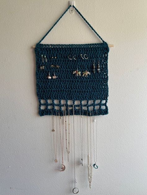 Creative Ways To Hang Jewelry, Crochet Wall Jewelry Holder, Earing Holder Crochet, Useful Crochet Projects For Men, Crochet Hanging Jewelry Holder, Crochet Book Holder Wall, Knit Jewelry Holder, Crochet Dorm Room Decor, Crochet Hanging Organizer