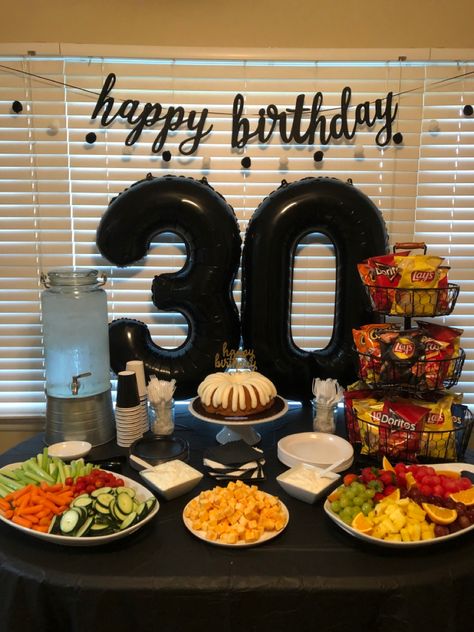 Simple and pretty 30th birthday party snack table and photo back drop 30th Party Decorations Men, Party For Him Men Birthday Ideas, 30th Mens Birthday Party, Big 30th Birthday Party Ideas, Outside 30th Birthday Party Ideas, 30th Bday Centerpieces For Men, 30th Birthday Set Up For Men, Dirty30 Birthday Ideas For Men, Husband Birthday Table Decor