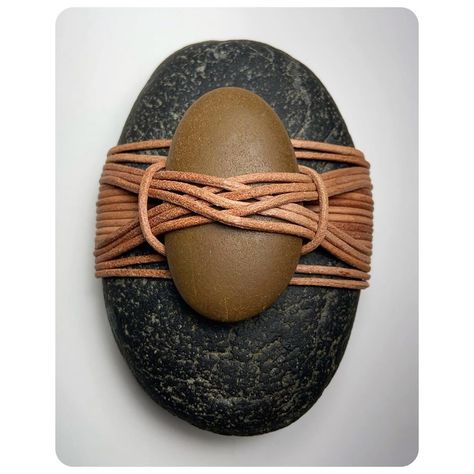 @zenolen shared a photo on Instagram: “Leather Rock Wrap - A New Design 🌿  #jdlenzen #tyingitalltogether #tiat #calming #rockart #leatherwork #rockwraps #naturalarts #rocks…” • Aug 15, 2020 at 11:05pm UTC Wrapped Rocks Tutorial, Weaving Stones, Weaving Rocks, Stone Wrapping Macrame, Wrapping Rocks, Stone Weaving, Diy Stone Wrapping, Rock Weaving, Stone Wrapping Tutorial