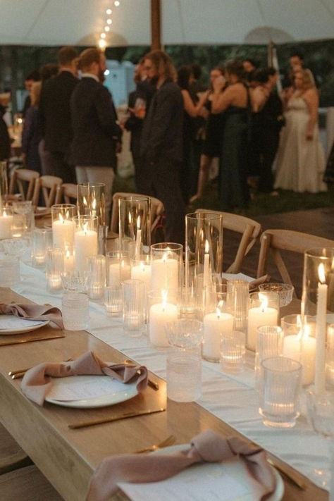 Nothing sets the mood quite like a candle-lit wedding tablescape! 🕯️✨ Who else loves the romantic glow?  📸: IG/bad_boss_bride Candle Light Wedding Table, Candle Only Table Decor Wedding, Outdoor Candle Lit Dinner, Wedding Candle Aesthetic, Candle Reception Table Decor, Pillar Candles Head Table Wedding, Candles Beach Wedding, Candle Only Tablescape, Tablescape Candles Wedding