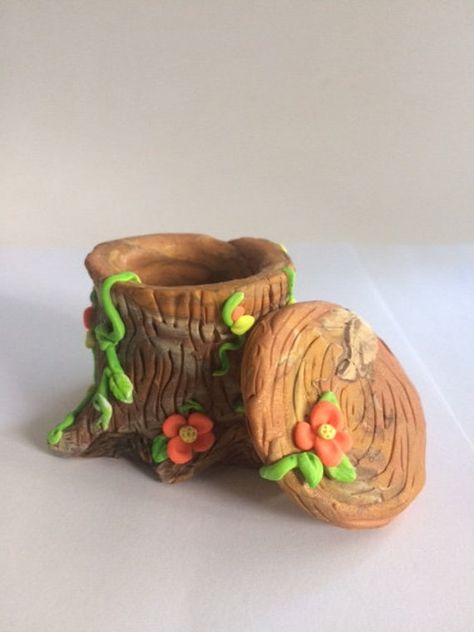 This handmade polymer clay Tree stump box, jewelry box, woodland box, peach flowers and green vines, perfect perch for a gnome or fairy, multicolored  Browns, not a toy, hold rings, and earring holder, secret container., one of a kind, fantasy, mint greens, all handmade, miniature art, collectible,fun my own creation.can hang anywhere not just on a Christmas tree.  One of a kind no molds or painting done on figurine she is cooked in the oven.  A final light coat glaze is used to give bit of shin Polymer Clay Useful Projects, Oven Bake Clay Jewelry Holder, Cute Clay Containers, Fairy Clay Ideas, Cute Clay Pencil Holder, Fairy Clay Art, Jewelry Box Clay, Clay Trinket Box Diy, Polymer Clay Cottagecore