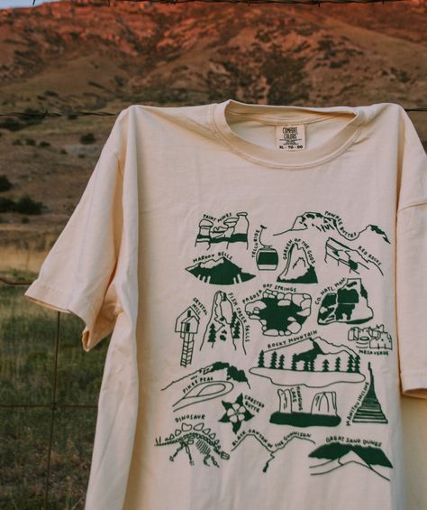 Our tribute to the nature in Colorado! This designs features all 4 national parks and 15+ other beautiful spots from Grand Junction to Denver. Let it remind you of the places you've been and inspire you to see the rest!  This item will ship within 1-2 business days of ordering. If combined with a made-to-order item, we National Parks Tshirt, Nature T-shirt, National Parks Shirt, Outdoor Graphic Tees, Adventure Tshirt Design, Travel T Shirt, Nature T Shirt, Granola Shirts, Nature Shirt Design