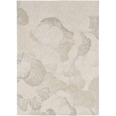 Refresh your space with the charming style of this taupe grey floral rug from the Avra Collection. The oversized botanical pattern is tufted with a textured cut-and-loop pile that adds a subtle sense of depth, making it a beautiful complement for your living room or bedroom décor. Handmade of wool, this contemporary rug is available in a variety of sizes, from 5 x 8 rugs for bedrooms and small spaces to large 8 x 10 and 9 x 12 rugs. Rug Size: Rectangle 5'3" x 7'3" | Brown 87 x 63 x 0.5 in Area R Rugs For Bedrooms, Carpet Design Pattern, Carpets Design, Stair Tread Rugs, Taupe Rug, Taupe Grey, Danang, Bedroom Décor, Indoor Rug