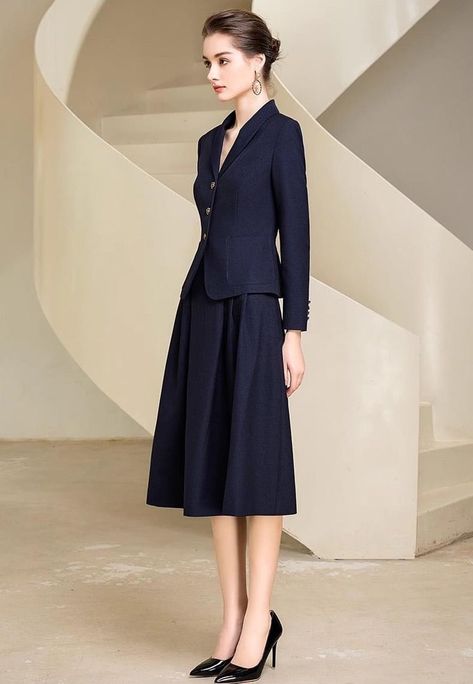 Look graceful and timeless in this two-piece chic midi skirt suit. With an elegant full skirt and tailored jacket, you'll feel timelessly elegant and sophisticated—perfect for work, special occasions, and everything in between. Make a statement in this beautiful skirt suit. Blazer and Full Midi Skirt V-Neck, Long sleeves Flap Pockets Structured shoulders. Polyester 100% Lining: Polyester 100% Imported Brand -Aision Model Number - 233017C1, 233017S2 Blazer And Long Skirt Outfits, Suit Skirt Outfit Classy, Graduate Clothes, Coat And Skirt Outfit, Elegant Outfit Classy Chic, Woman Suit Fashion Classy, Coat And Skirt, Casual Classy Outfits, Conference Outfit