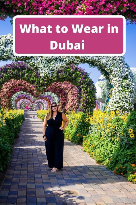 Hannah standing in Dubai miracle gardens with banner text reading what to wear in Dubai Dubai Miracle Garden Outfit Ideas, Dubai Outfits Ideas Curvy, Nails For Dubai Vacation, Dubai Womens Fashion, Modest Dubai Outfits Ideas, Dubai Attire For Women, What To Wear In Dubai Outfits Vacations, Dubai Tourist Outfit, How To Dress In Dubai