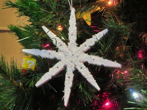 These snowflakes are hand crafted using clothes pins! Such a pretty ornament for your tree. You could also use it as a gift tag or decoration on a fancy wrapped gift for that someone special on your list. Size: 6" High x 6" Wide Handmade in America Snowflake Clothespin Ornament, Clothes Pin Snowflakes, Clothes Pin Ornaments, Wooden Christmas Tree Ornaments, Snowflake Christmas Ornaments, Dreamy Christmas, Clothespin Diy Crafts, Whimsical Christmas Tree, Clothespin Crafts