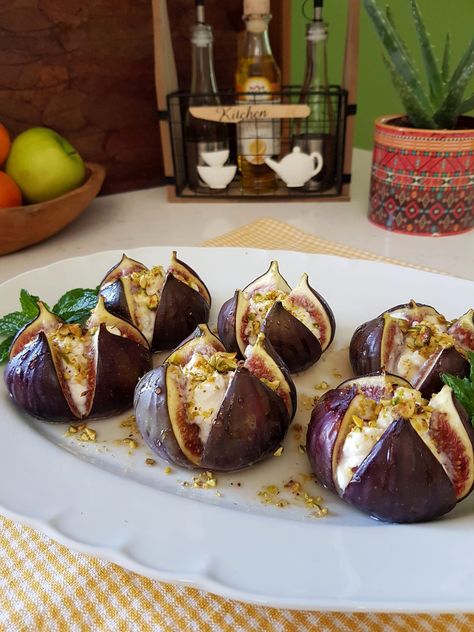 Indulge in the delightful combination of sweet, creamy, and nutty flavors with this elegant dish of Figs With Ricotta, Pistachios, and Honey. Fresh figs are complemented by a luscious ricotta and amaretto filling, topped with crunchy pistachios, and finished with a drizzle of golden honey. Baked briefly to enhance flavors, this recipe promises a perfect […] Fig Appetizer, Slow Cooked Chicken, Fig Recipes, Almond Flavor, Fresh Figs, Appetizer Salads, Diy Food Recipes, Appetizer Snacks, How To Cook Chicken