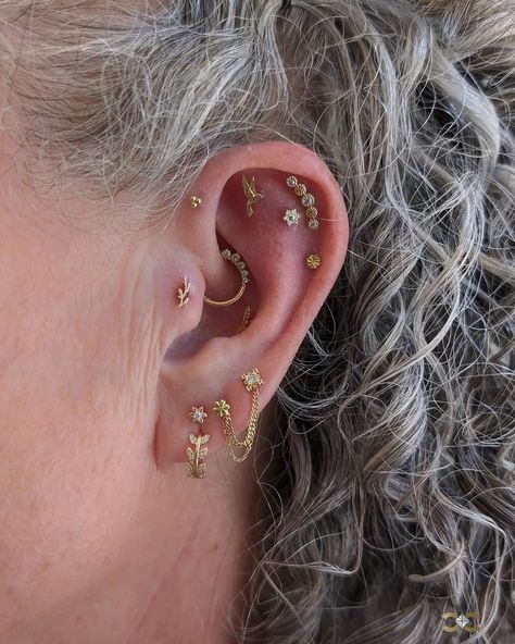 Experience the art of ear curation with our expert piercers, who meticulously design each look to enhance your unique style. Elevate your elegance with bespoke solid yellow gold ✨ adornments. #EarCuration #LuxuryPiercings #ExpertStyling ✨Pave Flower Vine Clicker Earring, 14k Yellow Gold ✨Gem Flower Push-In Stud Earring, 14k Yellow Gold ✨BVLA Flourish Illusion Threaded Stud Earring, 14k Yellow Gold ✨BVLA Amity Threaded Stud Earring, 14k Yellow Gold ✨Flower Push-In Stud Earring, Dome Center, 1... Clicker Earring, Curated Ears, Ear Curation, Flowering Vines, Gold Flower, Gold Flowers, Stud Earring, Solid Yellow, Unique Style