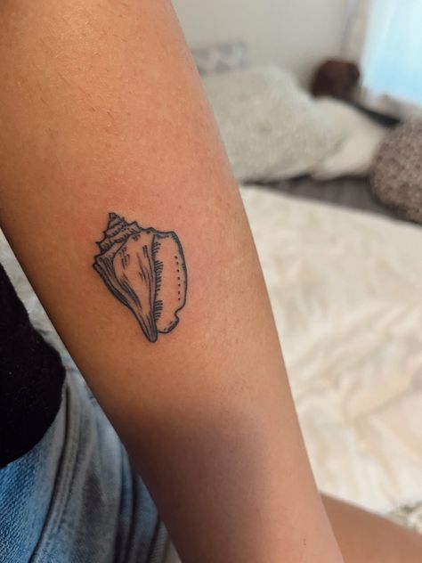 Shell Ankle Tattoo, Conch Tattoo Shell, Beach Back Tattoo, Coastal Tattoos For Women, Ocean Aesthetic Tattoo, She’ll Tattoo, Beach Related Tattoos, Belize Tattoo, Hermit Crab Tattoo