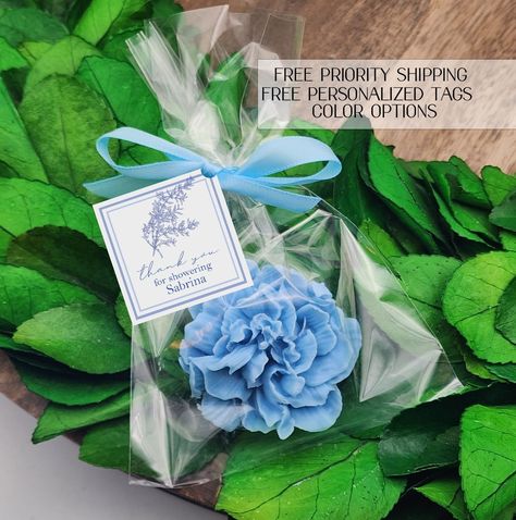 Blue floral party favors Give your event a personal touch with our personalized favors! Your guests will love these adorable soap favors! --- Hand poured shea butter soaps scented with essential oils --- Each favor is individually wrapped and includes a personalized tag, satin bow --- Satin bow color will match soap color choice --- Each soap weighs approx. one ounce each --- Each soap measures approx. 2.5  inches across and weighs approx. 1 ounce --- Available in four scents: Jasmine rose Laven Blue Bridal Shower Favors, Blue Wedding Favors, Rehearsal Dinner Favors, Quinceanera Favors, Bridal Shower Tags, Something Blue Bridal, Blue Bridal Shower, Dusty Blue Wedding, Light Blue Wedding