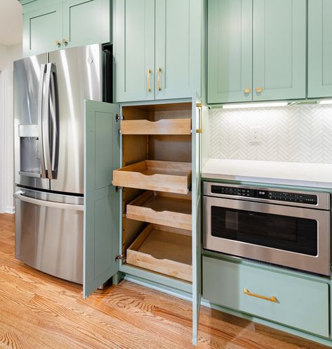 Reimagine your kitchen with a pull-out pantry that blends seamlessly with your appliances!   This clever design not only saves space but also adds a touch of sophistication. Keep your dry goods organized and close at hand for effortless cooking!      Visit our website to learn more about getting started: www.dreamhomecary.com/getting-started  #DreamHomeDesign #HomeRenovation #customizedcabinet #kitchenrenovations Pantry Next To Oven, Pull Out Pantry, Pantry Wall, House Projects, Dry Goods, Remodels, Clever Design, Getting Started, Dream Home Design