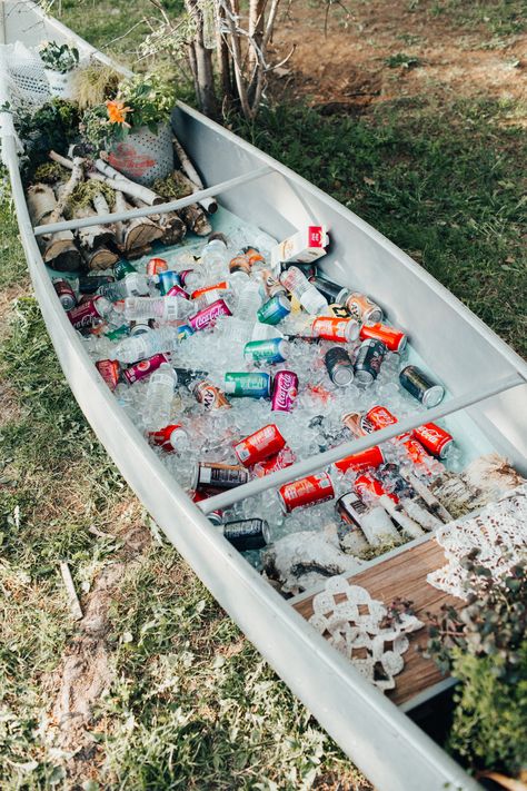 How cute is this drinks canoe used at this northern Minnesota backyard wedding?! Find more of this beautiful wedding in link! #backyardwedding #canoe #drinkscanoe #weddingreception #woodsywedding #woodsydecor #minnesotawedding #diywedding Wedding Canoe Drinks, Drinks Outdoor Wedding, Canoe With Drinks, Backyard Woodsy Wedding, Canoe Bar Wedding, Summer Backyard Wedding Ideas Receptions, Drink Canoe Wedding, Canoe Wedding Decor, Canoe Drinks Wedding