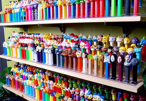 My brothers old college roommate collected Pez dispensers. But my goodness thats a lot! Pez Collection, College Roommate, Pez Dispensers, Candy Dispenser, Candy Holder, Graphic Design Studios, Barbie Collection, Sweet Candy, Weird And Wonderful