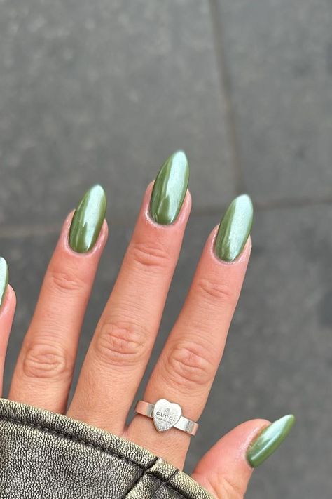 Step into a world of enchantment with these mesmerizing Chrome Olive Green Stiletto Nails. The captivating pearlescent finish and subtle shimmer create an ethereal glow, adding a touch of magic to any look! ✨ // Photo Credit: Instagram @atthestudioedinburgh Chrom Nail Designs, Gel X Green Nails, Olive Nails Chrome, Light Green Chrome French Tip Nails, Green Pearlescent Nails, Sage Green Nails With Chrome, Green Chrome Dip Nails, Green September Nails, Pistachio Chrome Nails