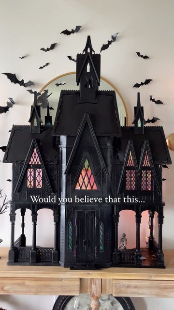 Heather Young on Instagram: "Some Halloween magic 🖤 . Run or take your broom, don’t walk to Facebook Marketplace and search “Elsa castle” or any dollhouse and you’ll have yourself the perfect haunted house for Halloween decor! I got mine off Facebook marketplace and these castles are always on there! I just spray painted it black, added some cellophane wrap behind the windows and some orange string lights! . The bats are from Amazon and linked along with the sconces and entryway table! . #worldmarketfinds #diy #beforeandafter #halloween #howihome #myhome #myhomevibe #interiordesign #halloweencrafts #entryway #spookyseason #spooky #halloweendollhouse #bats" Painted Haunted House Craft, Dollhouse Haunted House Diy, Halloween Doll House Diy, Spooky Doll House, Spooky Dollhouse Diy, Diy Haunted House Dollhouse, Dollhouse Repaint, Halloween Dollhouse Diy, Dollhouse Entryway