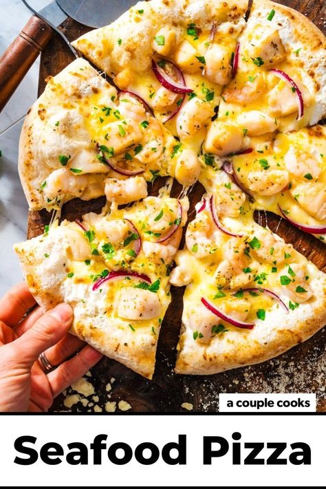 This seafood pizza is bursting with flavor, starring succulent shrimp and scallops, seasoned ricotta, and gooey mozzarella cheese. It’s a winner! Pop over to our site for the recipe! Ooni Pizza Dough, Seafood Delight, Ooni Pizza, Vegetarian Bbq, Seafood Pizza, A Couple Cooks, Mediterranean Diet Recipes, Pizza Toppings, Pizza Recipes