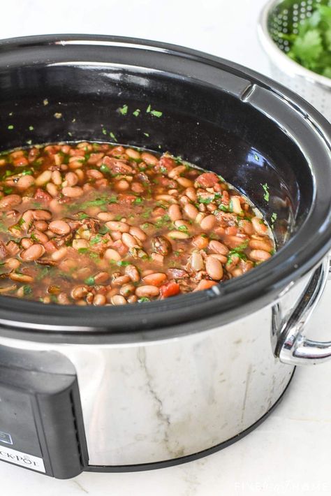 Slow Cooker Charro Beans ~ flavored with bacon, garlic, tomatoes, green chiles, jalapeños, cilantro, and spices and cooked in the crock pot to make them hands-off and truly effortless...the perfect side dish for Mexican food! | FiveHeartHome.com Charro Beans Recipe Crockpot, Crock Pot Charro Beans Slow Cooker, Ranchero Beans Crockpot, Mexican Beans Recipe Slow Cooker, Mexican Beans Recipe Crockpot, Churro Beans Crockpot, Best Bean Recipes Crock Pot, Charo Beans Recipe Slow Cooker, Crockpot Frijoles Charros