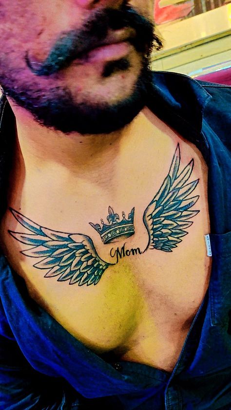 King Tattoo Men, Wings Tattoo Men, Mom Tattoo For Men, Chest Tattoo Wings, Tato Nama, Tattoo King, Cross With Wings Tattoo, Wing Tattoo Men, King Tattoo