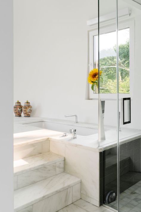 Bathroom Ideas - This modern bathroom has a built-in bathtub that's accessed via a few steps. #Bathroom #BathroomIdeas #Bathtub #BuiltInBath Bathtub With Steps, Build In Bathtub, Step In Bathtub, Built In Bathtub, Built In Bath, Architectural Materials, Tub Ideas, Grey Countertops, Bathroom Fittings