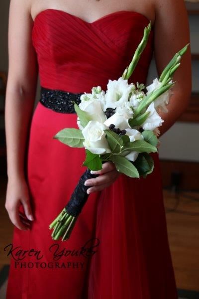 Bridesmaid bouquet: white rose, gladiolus, and black berries. Photo courtesy of Karen Youker Photography. Gladiolus Bridal Bouquet, Gladiolus Wedding Bouquet, Gladiolus Wedding Flowers, Gladiolus Wedding, Gladiolus Bouquet, Gladiolus Arrangements, Christmas Wedding Bouquets, Bride Groom Table, Bridesmaid Bouquet White