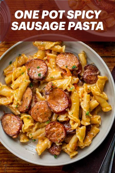 One Pot Spicy Sausage Pasta is pan-seared andouille smoked sausage, campanelle pasta, and a creamy, cheesy, spicy sauce. Dinner Recipes Sausage, Spicy Sausage Recipes, Spicy Pasta Recipes, Andouille Sausage Recipes, Creamy Sausage Pasta, Bologna Recipes, Campanelle Pasta, Sausage Pasta Recipe, Spicy Sausage Pasta