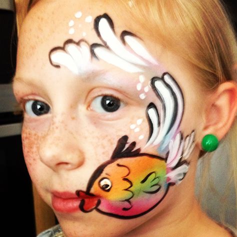 Kids fish face paint #snazaroo #facepaint Fish Face Paint, Mermaid Face Paint, Bodysuit Tattoos, Animal Face Paintings, Cheek Art, Girl Face Painting, Fish Face, Face Painting Easy, Kids Face Paint