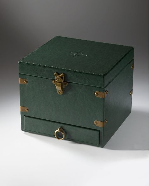 Inspired by decades of travel, we worked with masterful makers to create these stylish cases. Made with vegan leather in our signature Maker Green, the Maker Trunk features bespoke details like antique brass hardware, an ultrasuede lining in our botanical pattern, and removable dividers. The trunk is perfect for storing fragrance, candles, jewelry, photographs, and more. Stunning on its own, you can also purchase it as part of our custom Fragrance Trunk collection. Size: Small is 8”L x 5”W x 6”H Signature Maker, Watch Packaging, Club Tropicana, Candles Jewelry, Leather Trunk, Leather Coasters, Travel Box, The Trunk, Antique Brass Hardware