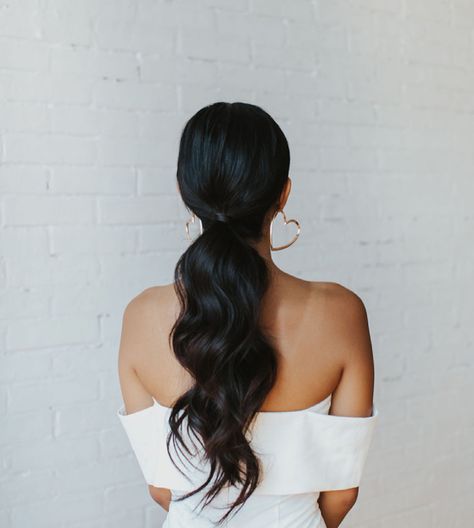 Low ponytail with loose waves Low Pony With Front Pieces, Dark Hair Down Wedding Styles, Wedding Day Ponytail With Veil, Low Ponytail With Two Bangs, Bridal Low Ponytail Hairstyles, Wedding Reception Ponytail, Low Pony With Headband, Low Pony With Curls, Bridal Ponytail Dark Hair